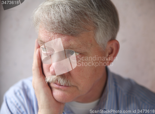 Image of senior man worries 