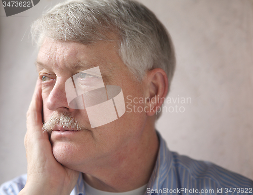 Image of annoyed older man 