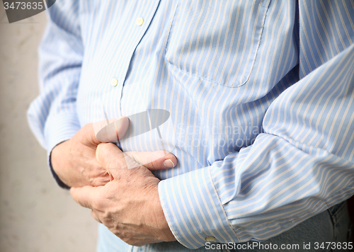 Image of businessman with bad stomach pain