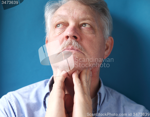 Image of man feeling painful lymph glands