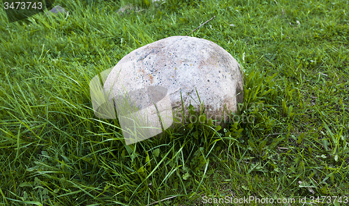 Image of stone on a grass 