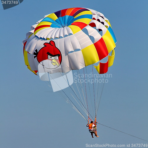 Image of Parasailing in a blue sky.