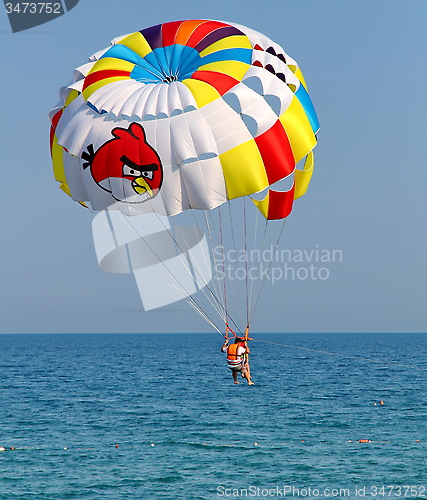 Image of Parasailing in a blue sky.