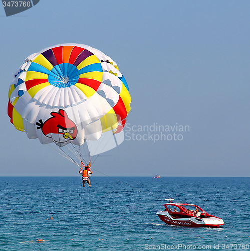 Image of Parasailing in a blue sky.