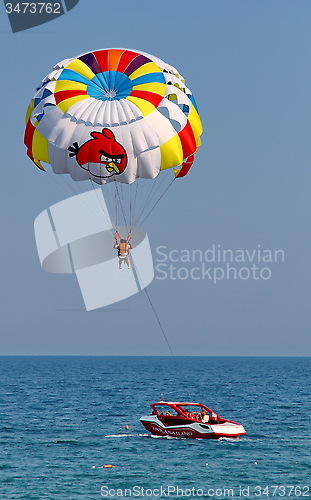 Image of Parasailing in a blue sky.