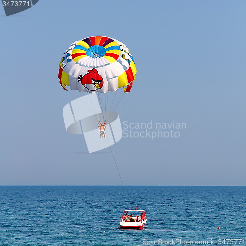Image of Parasailing in a blue sky.
