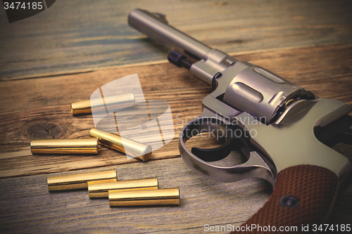 Image of revolver Nagant with cartridges