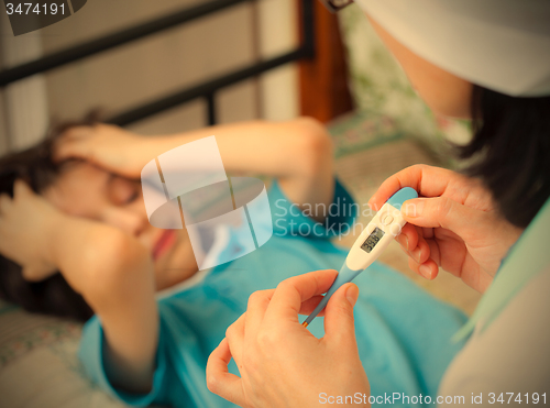 Image of digital thermometer in the hands of a doctor. Temperature measur