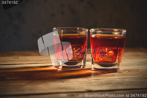 Image of two glasses of old whiskey