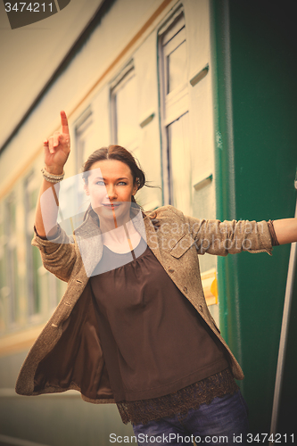 Image of beautiful middle-aged woman depart on a trip