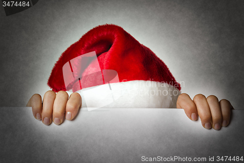 Image of Hiding Santa woman