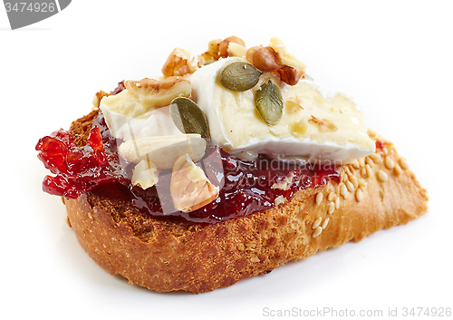 Image of toasted bread with jam and brie cheese