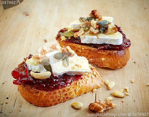 Image of bread with jam and brie cheese