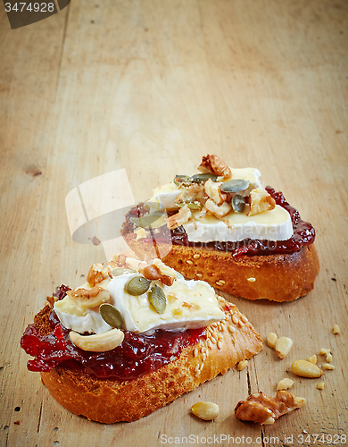 Image of bread with jam and brie cheese