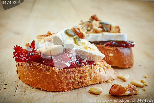 Image of bread with jam and brie cheese