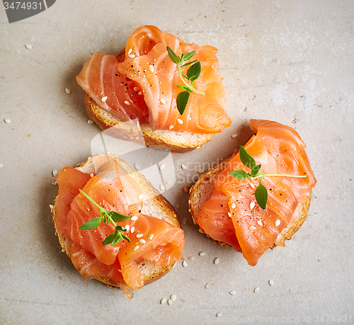 Image of bread with salmon fillet