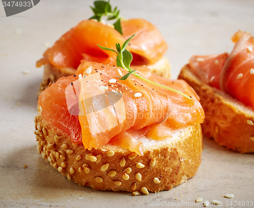Image of bread with salmon fillet