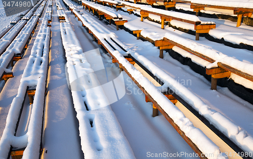 Image of benches under snow  