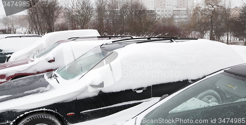 Image of cars under snow  