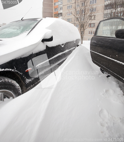 Image of cars under snow  