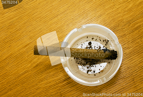 Image of Brown cigar broken