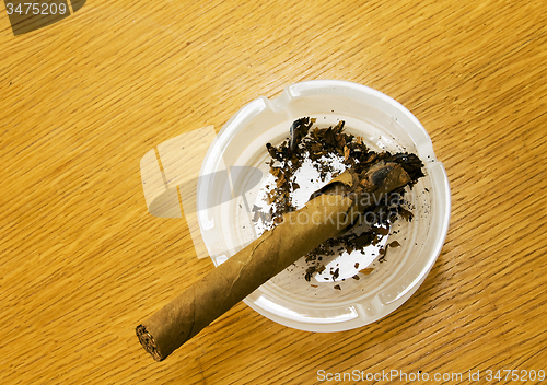 Image of Brown cigar broken