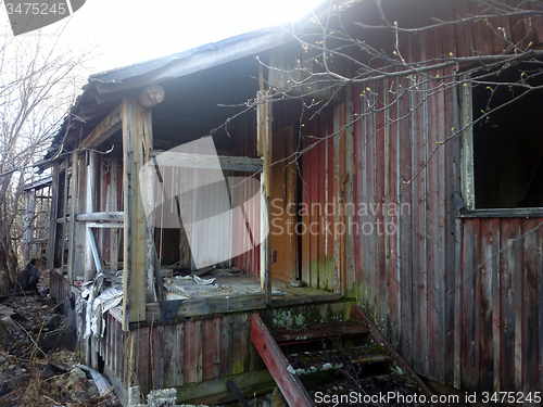 Image of destroyed house  porch and entrance ruins