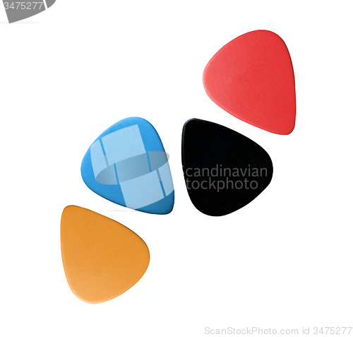 Image of Closeup of 4 colourful plectrums