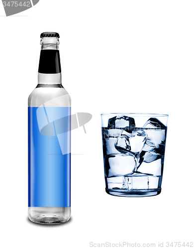 Image of bottle and glass with ice cubes 