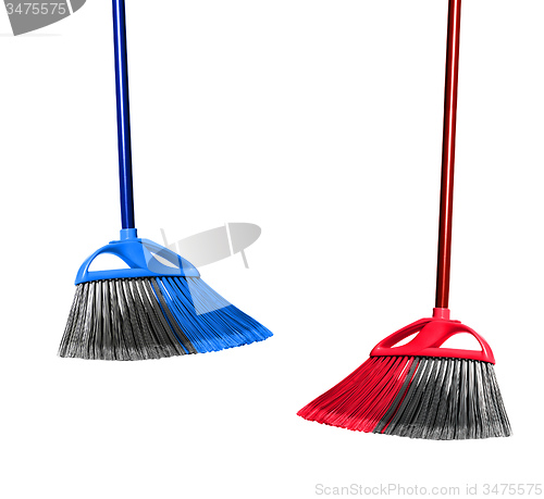 Image of plastic blue and red brooms isolated