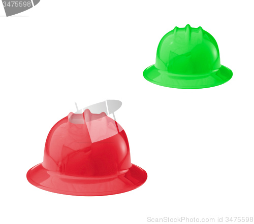 Image of Red and green construction helmets shot