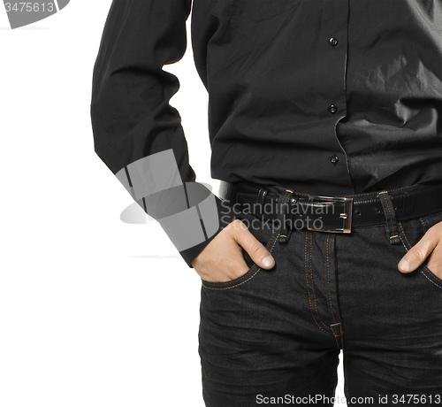 Image of businessman with hands in pockets