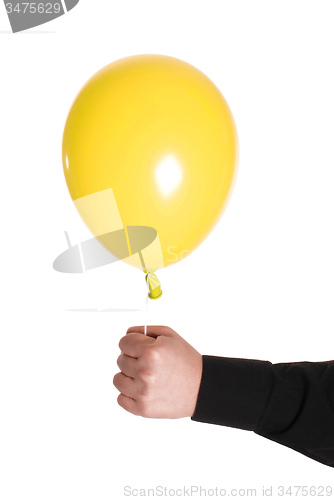 Image of man holding yellow baloonn