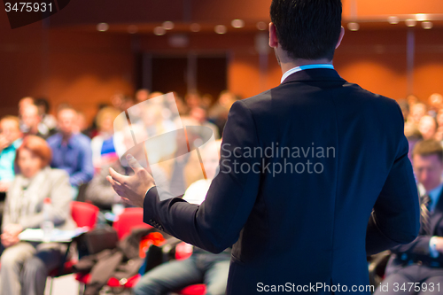 Image of Speaker at Business Conference and Presentation.