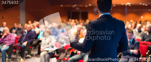 Image of Speaker at Business Conference and Presentation.