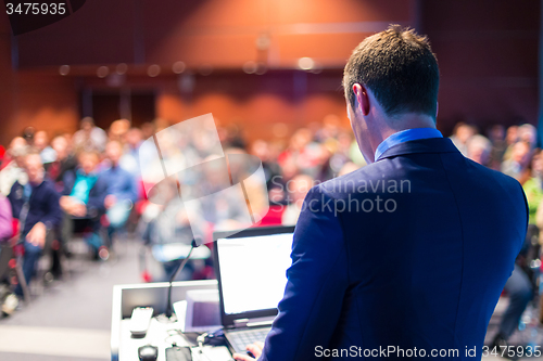 Image of Speaker at Business Conference and Presentation.