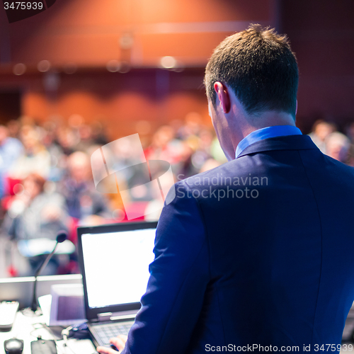 Image of Speaker at Business Conference and Presentation.