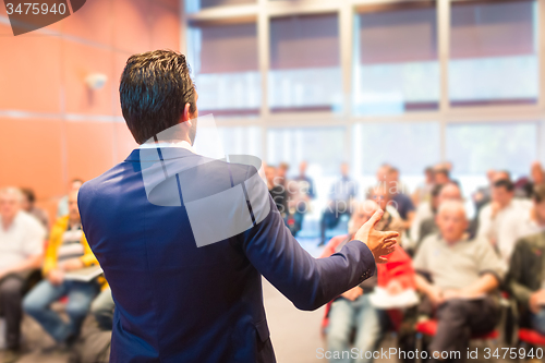 Image of Speaker at Business Conference and Presentation.