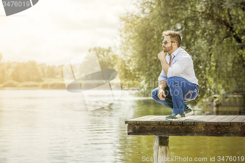 Image of man at the lake