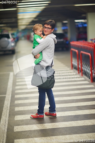 Image of mother with baby in shopping