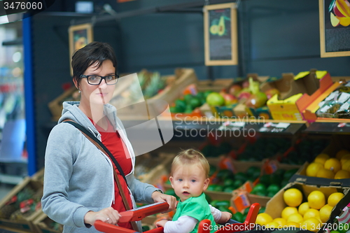 Image of mother with baby in shopping