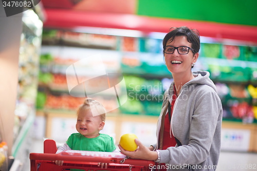 Image of mother with baby in shopping