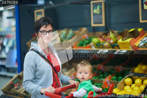 Image of mother with baby in shopping