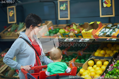 Image of mother with baby in shopping