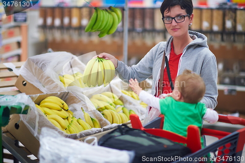 Image of mother with baby in shopping