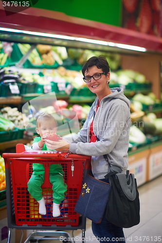 Image of mother with baby in shopping