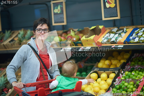 Image of mother with baby in shopping