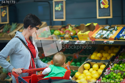 Image of mother with baby in shopping