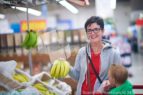 Image of mother with baby in shopping