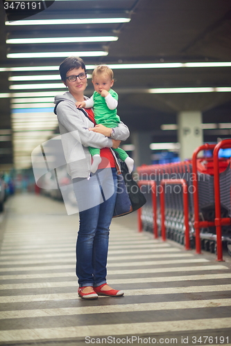 Image of mother with baby in shopping